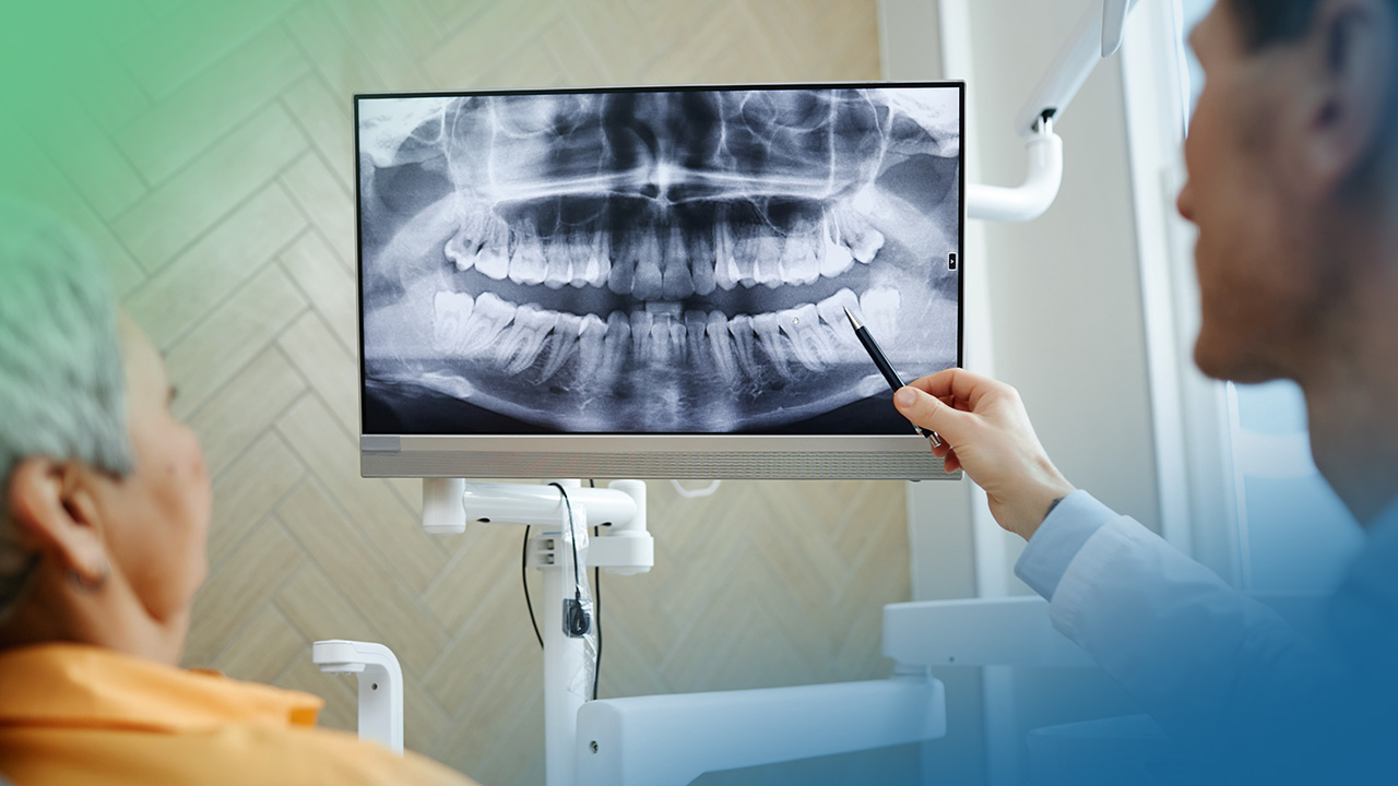 Doctor reviewing dental x-rays with a patient